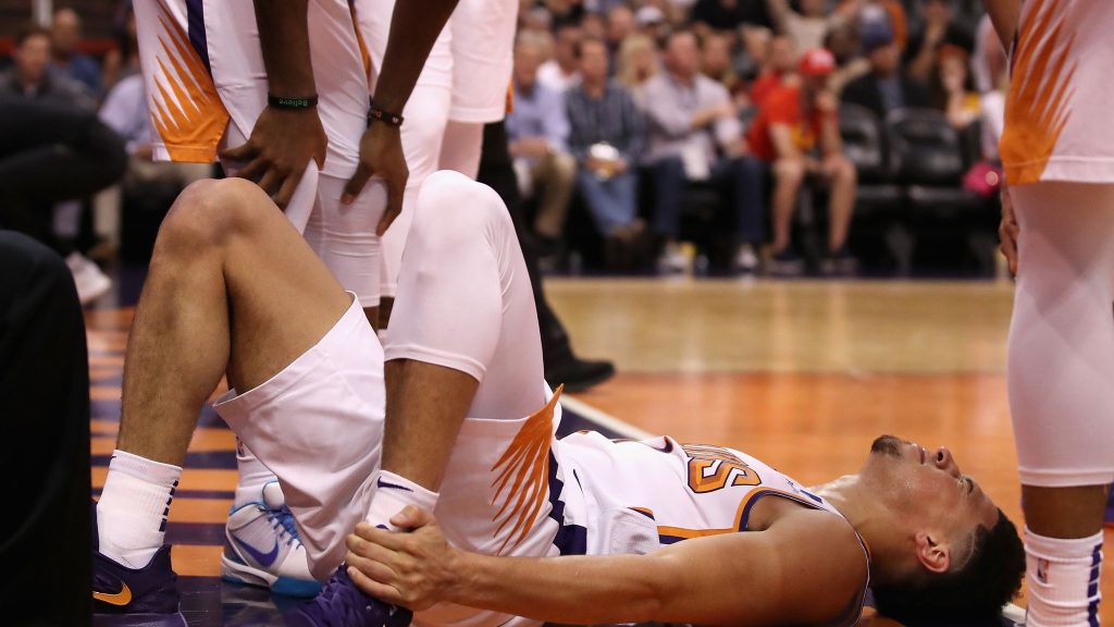 Phoenix Suns' Devin Booker to Be Sidelined for at Least One Week After Ankle Injury